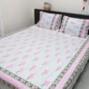 A luxurious, soft twill premium hand block bedsheet draped elegantly over a bed, showcasing intricate hand-blocked designs in soothing colors, promising a comfortable and stylish addition to any bedroom décor