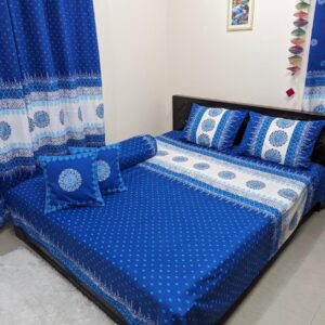 Indulge in luxury with handcrafted Soft Twill Cotton king-size bedsheet, meticulously block-printed on 100% pure cotton reminiscent of tranquil ocean blues, enhancing room's ambiance with elegance and style.